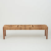 Azul rope‑weave 3‑seater bench with banana‑leaf seat and caramel‑stained oak frame, front view on white.